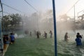 Teenage group of people enjoying holiday in water park.